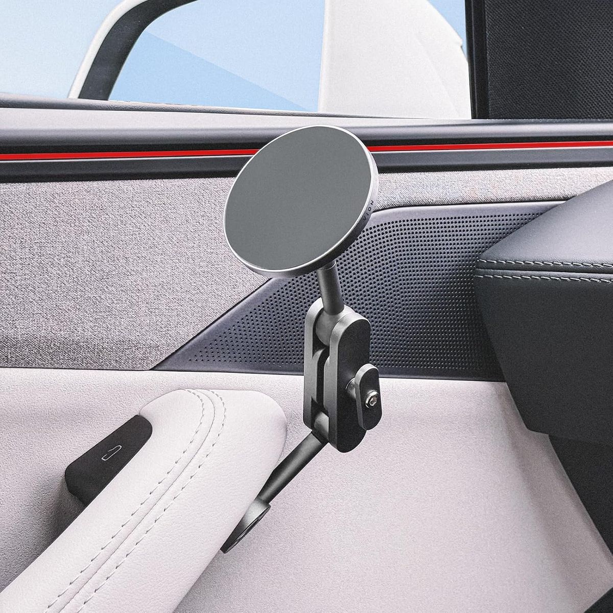 VION Premium Alloy Phone Mount screwed in by the Tesla Model Y driver door handle